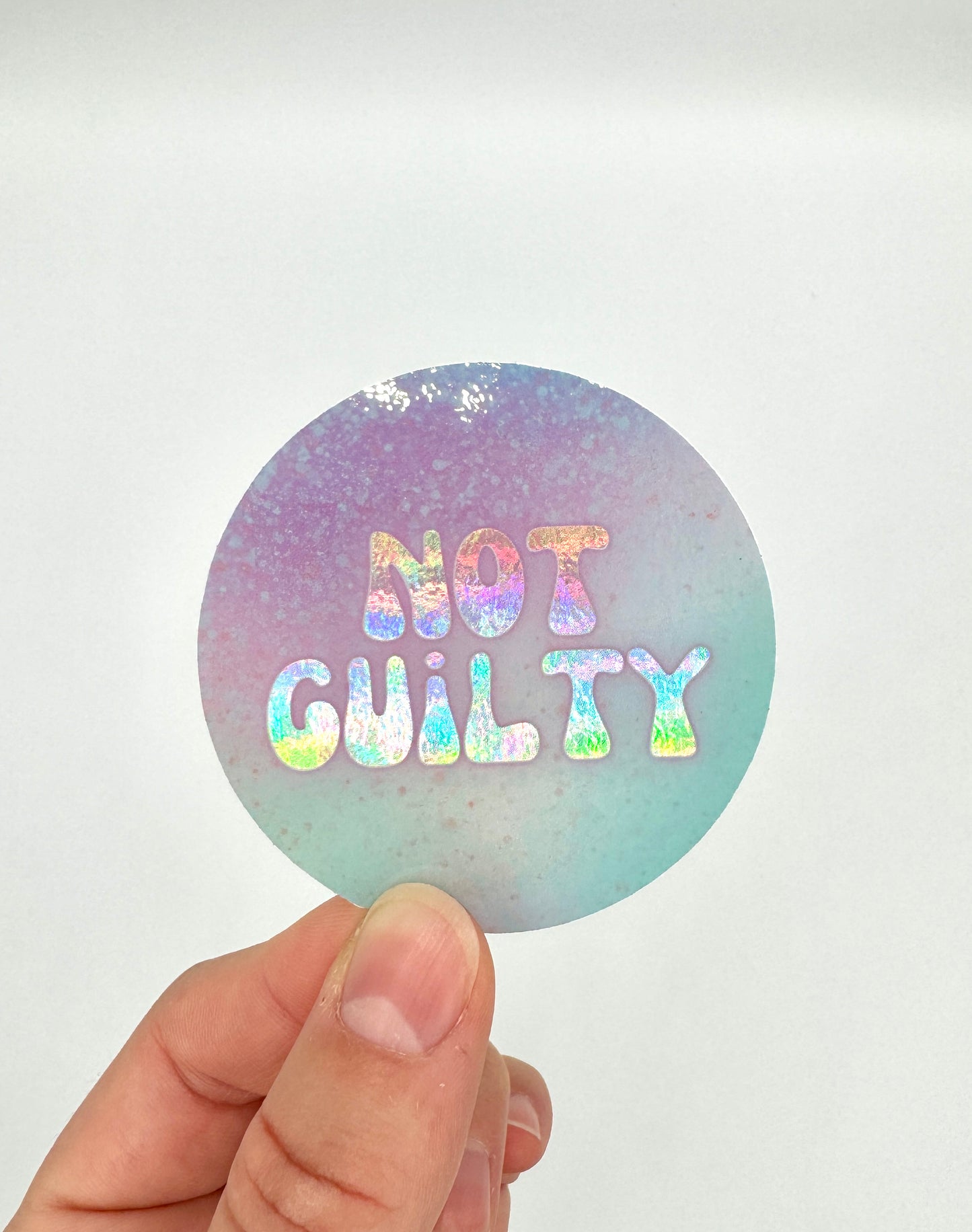 Not Guilty Holographic 🪩💁🏻♀️ Sticker - 2.5”